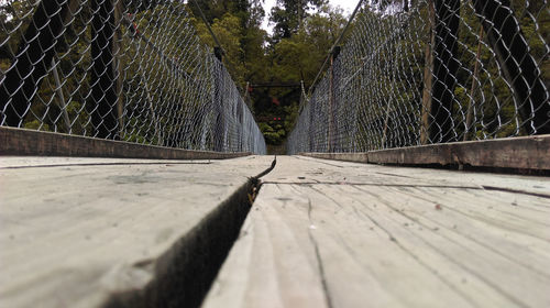 Surface level of wooden fence on footpath