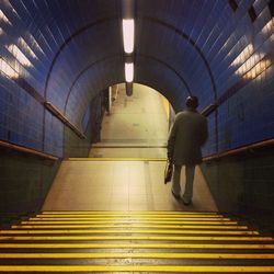 People walking in subway tunnel