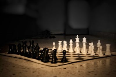 Close-up of chess pieces on floor