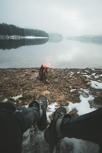 Scenic view of lake against sky during winter