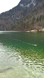 Scenic view of lake with mountains in background