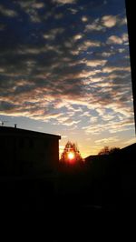 Silhouette of built structure at sunset