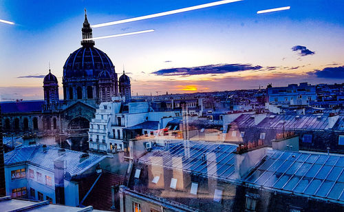 Cityscape against sky during sunset