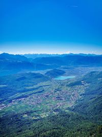 Scenic view of landscape against blue sky