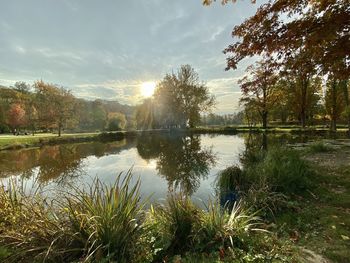 Scenic view of lake against sky during sunset