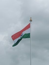 Low angle view of flag against sky