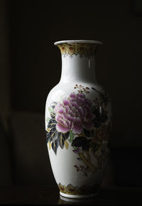 Close-up of vase against black background