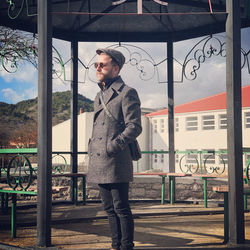 Portrait of young man standing in park