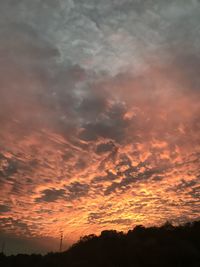 Low angle view of dramatic sky during sunset