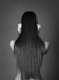 Rear view of woman with long straight hair