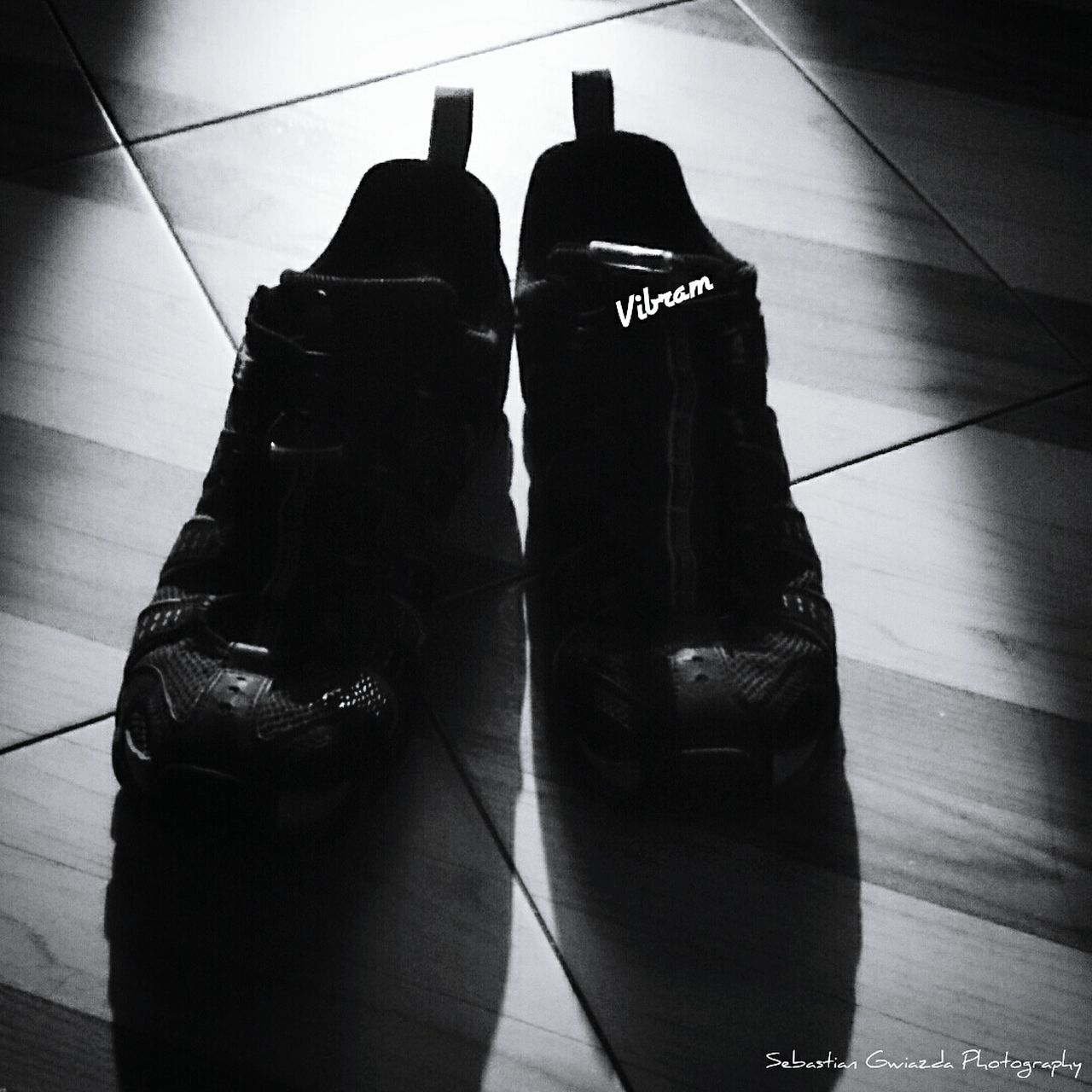 indoors, high angle view, men, shoe, shadow, close-up, technology, black color, standing, unrecognizable person, lifestyles, connection, flooring, leisure activity, reflection, still life, day, photography themes