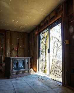 Interior of abandoned house with tv