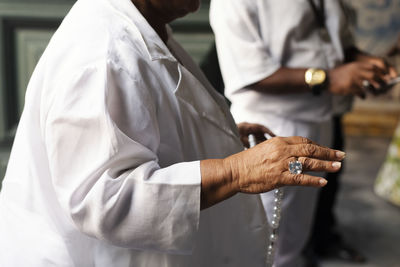 People at the religious mass of santo antonio de categero in rosario dos pretos church 