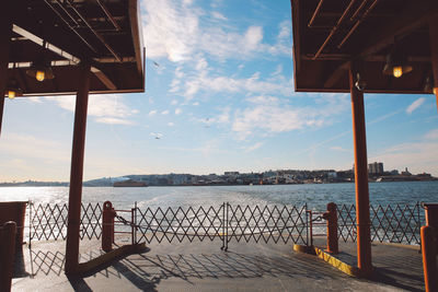 Ferry sailing in river against sky