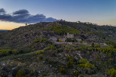 Drone aerial panorama of termas radium hotel serra da pena at sunset in sortelha, portugal