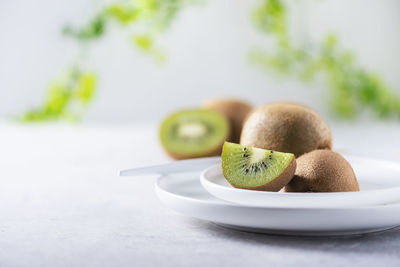 Close-up of fruits in plate on table