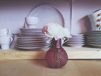 Flower vase on table at home