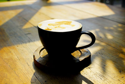 High angle view of coffee cup on table