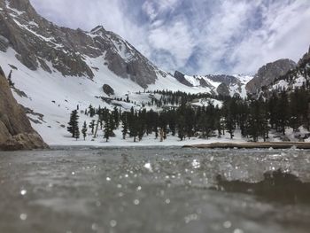 Scenic view of snow covered mountains against sky