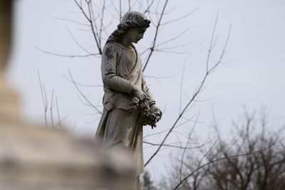 Female sculpture at cemetery