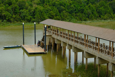 The view of a jetty bridge at chini lake, pahang, malaysia which is the second largest natural lake.