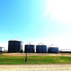 Barn on field against clear sky