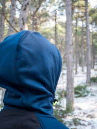 Rear view of man in forest