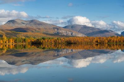 Beautiful landscape of norway mountain and forest reflecting in the water