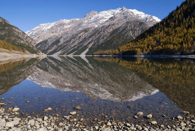 Reflection of mountains in calm lake