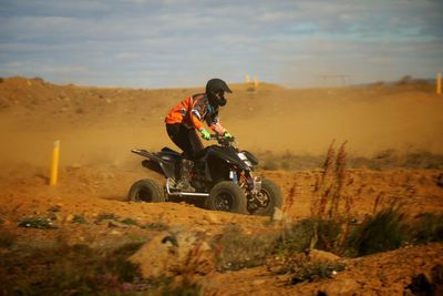 Man quadbiking on sand at reykjanes