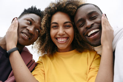 Smiling young woman with friends