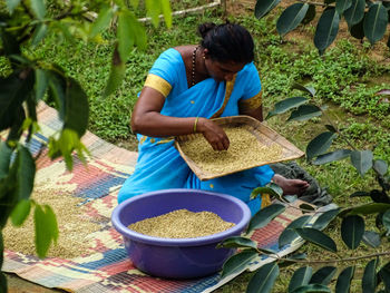 Woman sorting food grains 