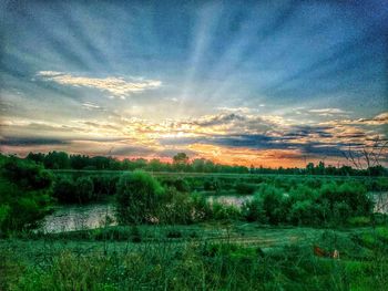 Scenic view of landscape against cloudy sky