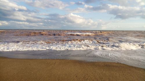 Scenic view of beach against sky