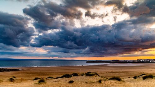 Scenic view of sea against cloudy sky