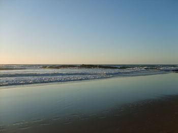 Scenic view of sea against clear sky