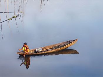 Woman in boat on lake