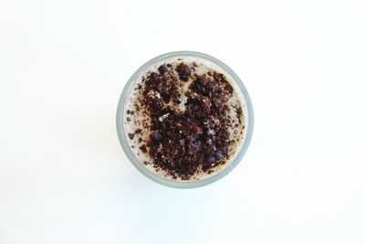 Directly above shot of cake against white background