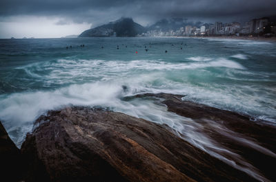 Scenic view of ipanema beach, rio de janeiro, on a rainy day
