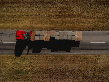 High angle view of construction materials on truck at field during sunny day
