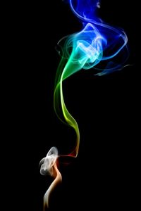 Close-up of light painting against black background