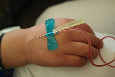 Child's hand with iv drip attached