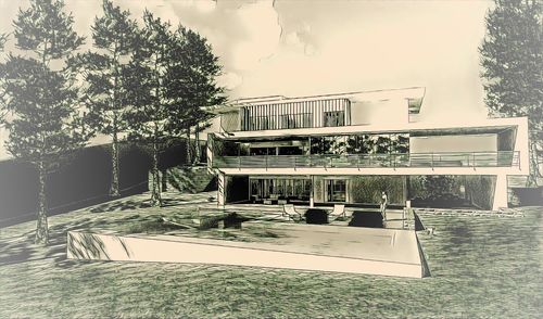 View of swimming pool by building against sky