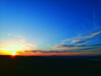 Scenic view of silhouette landscape against romantic sky at sunset