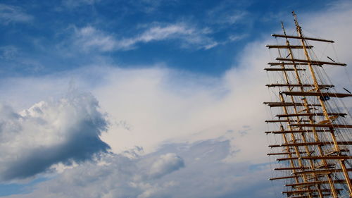 Low angle view wooden masts of sailboat