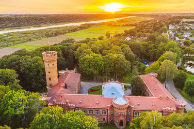 High angle view of trees and buildings against sky