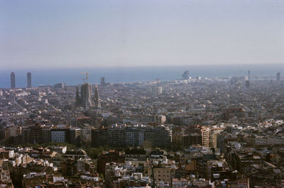 High angle view of city buildings against sky