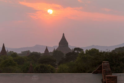 View of historic building against sky during sunset