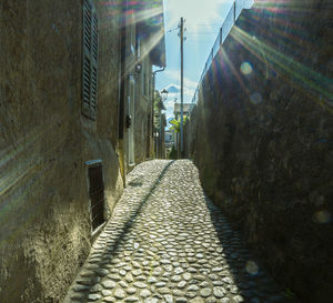 Narrow alley amidst buildings in city