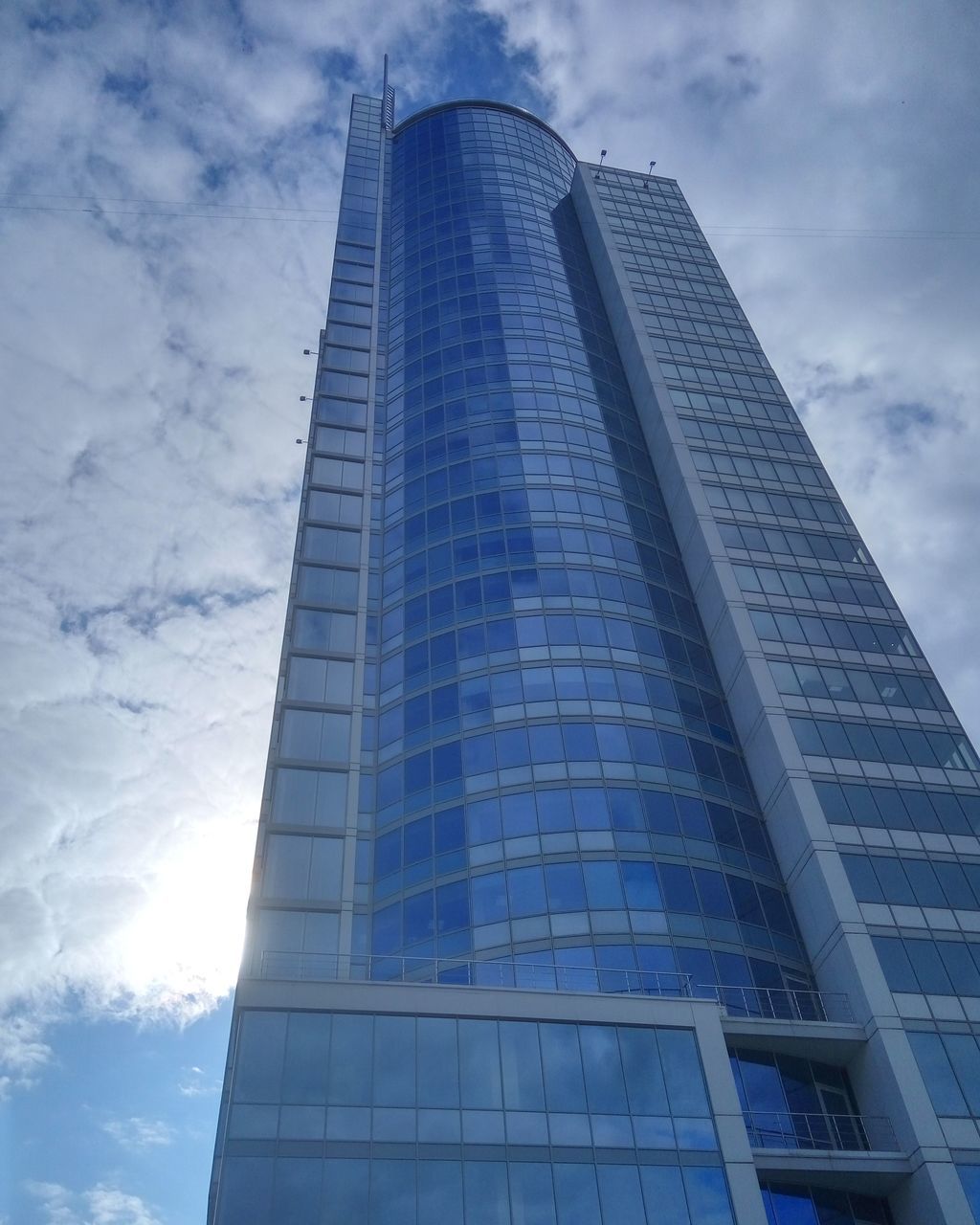 architecture, modern, low angle view, skyscraper, built structure, sky, tower, tall - high, building exterior, day, cloud - sky, tall, city, no people, outdoors